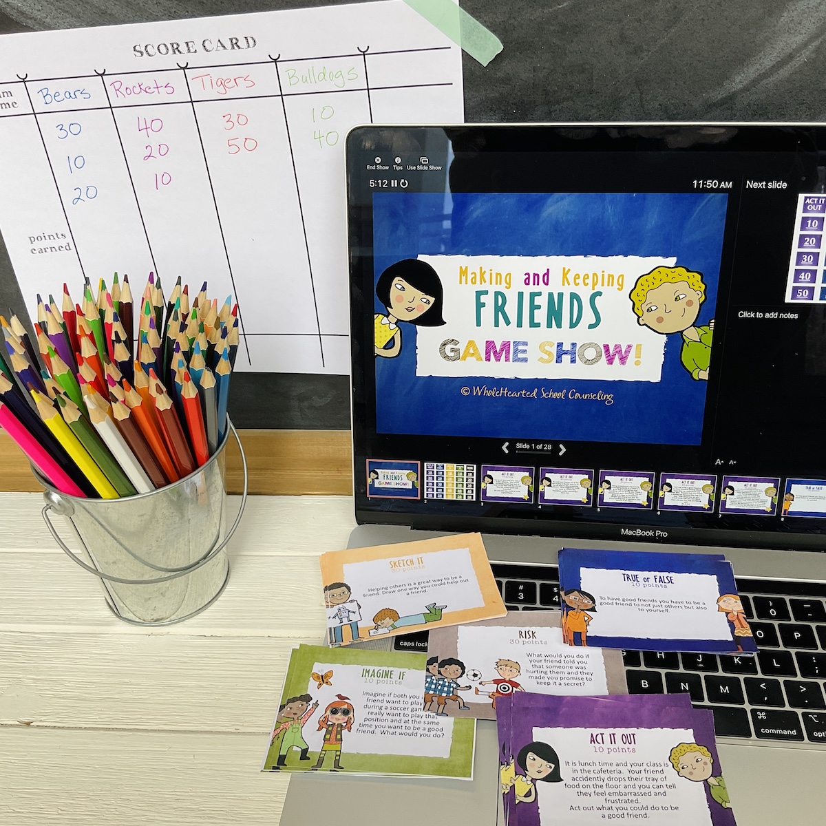 Computer with Making and Keeping Friends Lesson displayed on screen with friendship task cards.