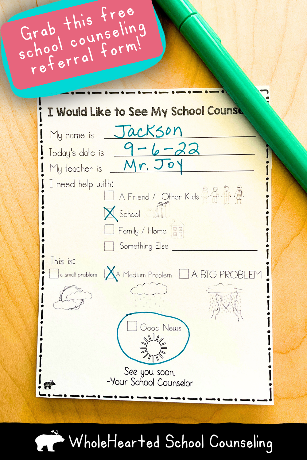School Counseling referral form on clipboard with blue pen.